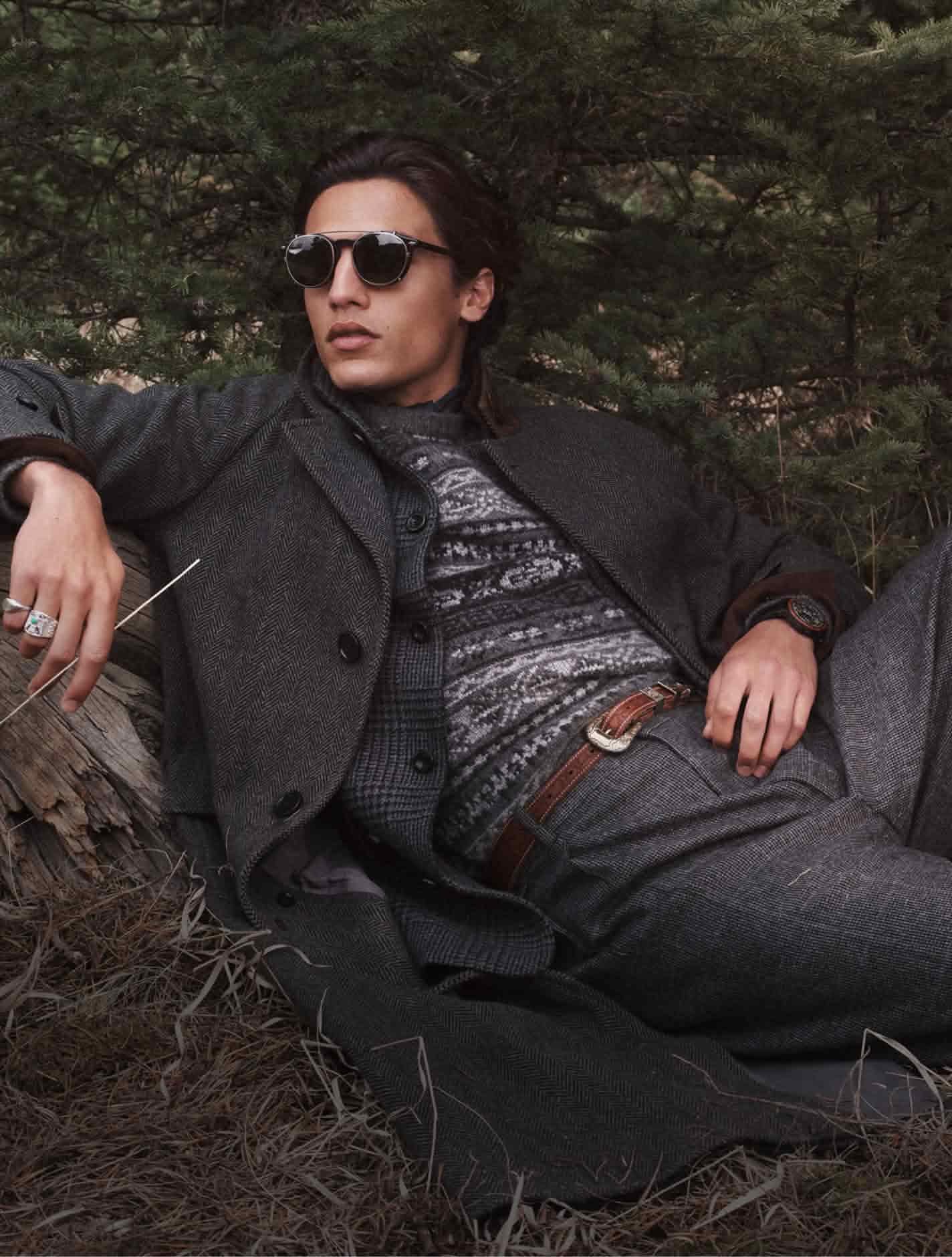Man in fairaisle grey jumper, grey tweed jacket and trousers